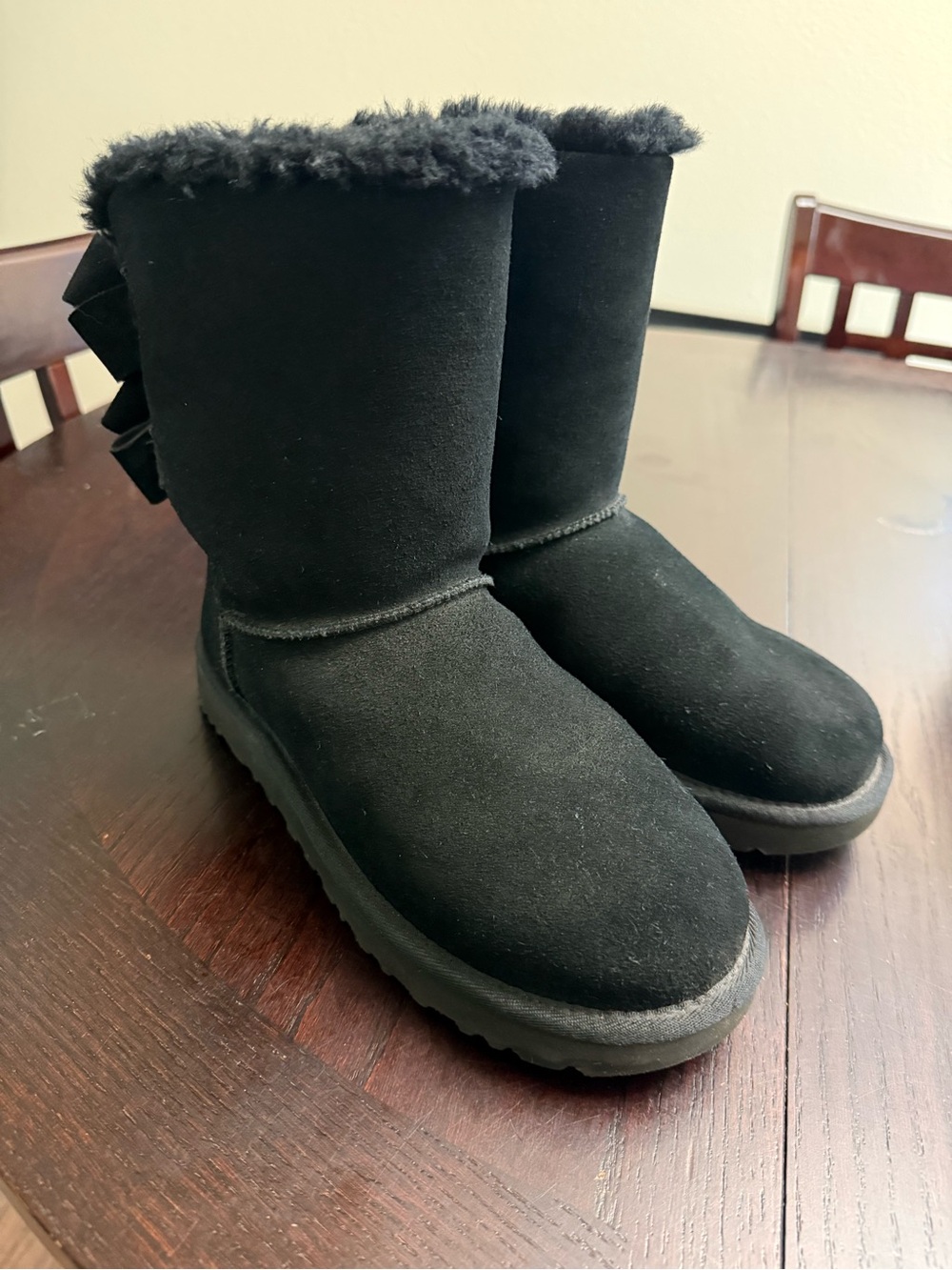 UGG boots with bows on back. Only wore a couple times.